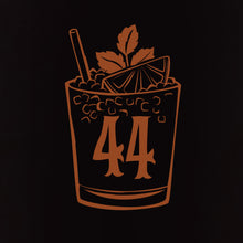 A copper illustration on black shows a cocktail glass with ice, lime, mint, a straw, and the number 44, embodying Jeff Granitos 44 Mai Tai Unisex Tee - Pre-Order.