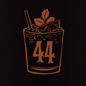 A copper illustration on black shows a cocktail glass with ice, lime, mint, a straw, and the number 44, embodying Jeff Granitos 44 Mai Tai Unisex Tee - Pre-Order.